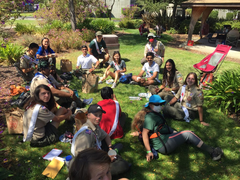 Members of the Order of the Arrow relaxing on the grass at areaclave